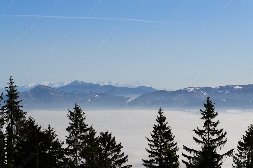 Clouds inversion in the town during autumn morning from mountains. Slovakia