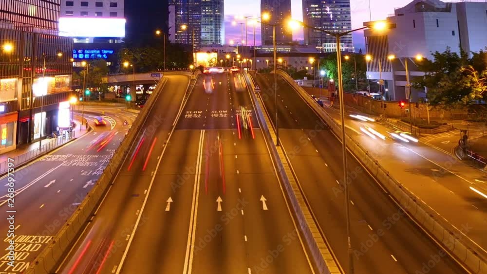 Time lapse day to night light traffic on the road with Hong Kong cityscape skyline at central district with distortion from super wide angle len Time lapse day to night light traffic on the road with Hong Kong cityscape skyline at central district with distortion from super wide angle len