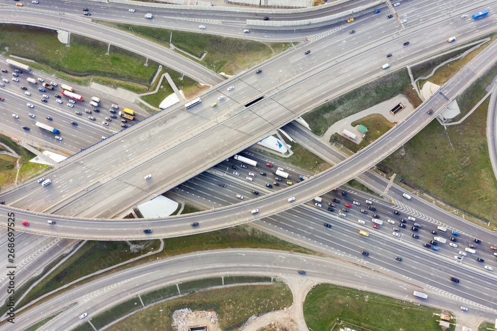 Aerial view of road junction in Moscow from above, automobile traffic and jam of many cars, road junction on the Moscow Ring Road and the M11 toll road. Aerial view of road junction in Moscow from above, automobile traffic and jam of many cars, road junction on the Moscow Ring Road and the M11 toll road.