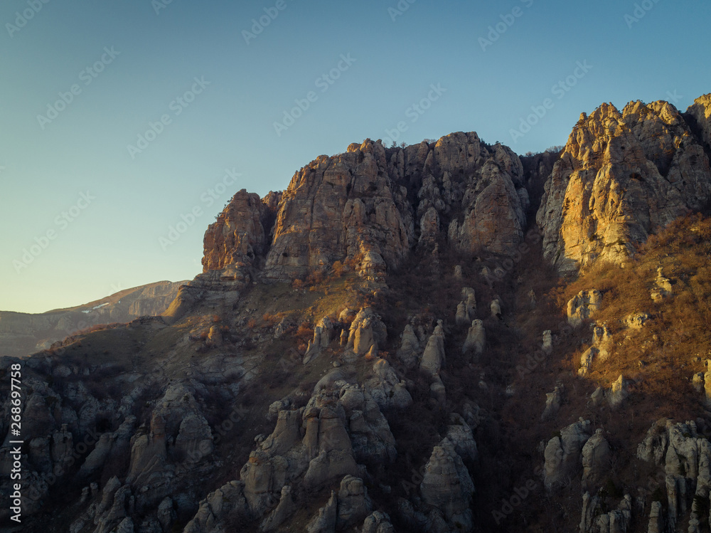 Demerdzhi mountain range in the rays of the setting sun. Autonomous Republic of Crimea Demerdzhi mountain range in the rays of the setting sun. Autonomous Republic of Crimea
