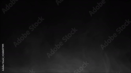 Thin wispy smoke or vapor on black background for compositing, slowly rising and dissipating