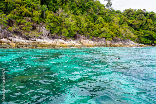 Beautiful tropical nature landscap, clear and clean turquoise sea and the tourist are snorkeling is a shallow dive site at Ko Ka Ta near Koh Lipe island Tarutao National Park, Satun, Thailandat