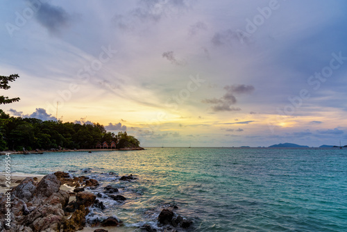 Beautiful tropical nature landscape colorful the sky at sunset over the sea rocks and resort on the beach in summer at the Sunset Beach on Koh Lipe island, Tarutao National Park, Satun, Thailand
