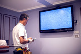 A man worker fix tv with blue screen 