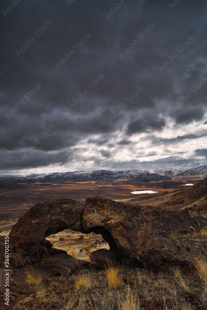 Rock arch with clouds