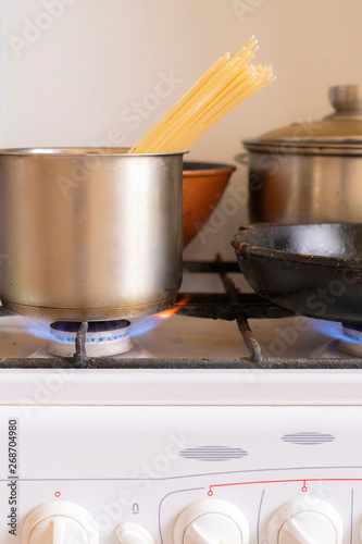 working obrn eith burning gas and pan with boiling tasty food in it,home cookings