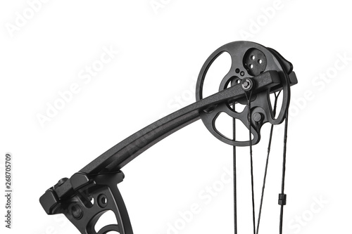 Closeup of the cam on a compound bow. modern, compound hunting bow and arrows  isolated on white photo