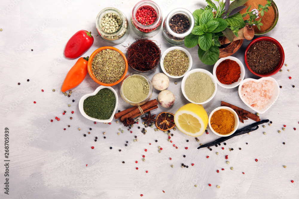 Spices and herbs on table. Food and cuisine ingredients with basil Spices and herbs on table. Food and cuisine ingredients with basil