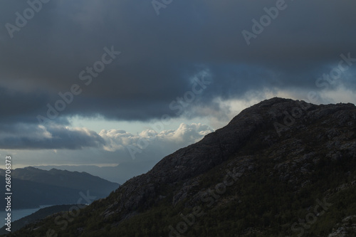 Mountain Ridge with dramatic clouds and skies and sun beams