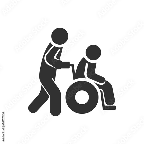 man driving a person in a wheelchair