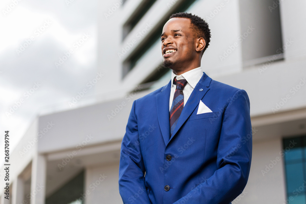 Outdoor standing portrait of a black African American business man Outdoor standing portrait of a black African American business man