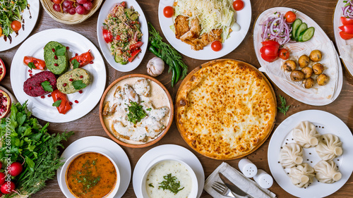 Georgian cuisine foodset from khachapuri, khinkali, pkhali, dolma, satsivi top view
