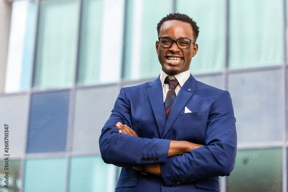Outdoor standing portrait of a black African American business man Outdoor standing portrait of a black African American business man
