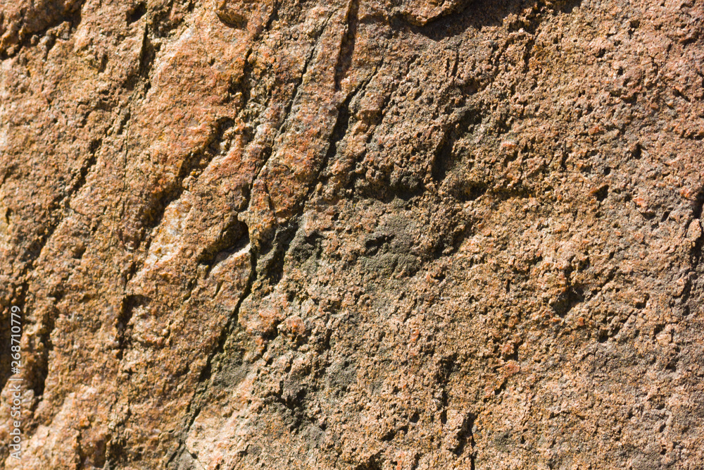 Background of granite. Texture of granite stone. Pattern of roughened surface. Texture of brown stone Background of granite. Texture of granite stone. Pattern of roughened surface. Texture of brown stone