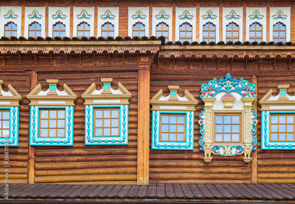 Fototapeta premium Decorated windows in old wooden house