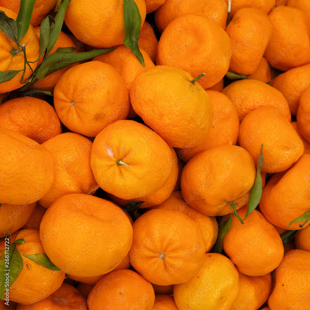 Orange fruit display at farmers market Orange fruit display at farmers market