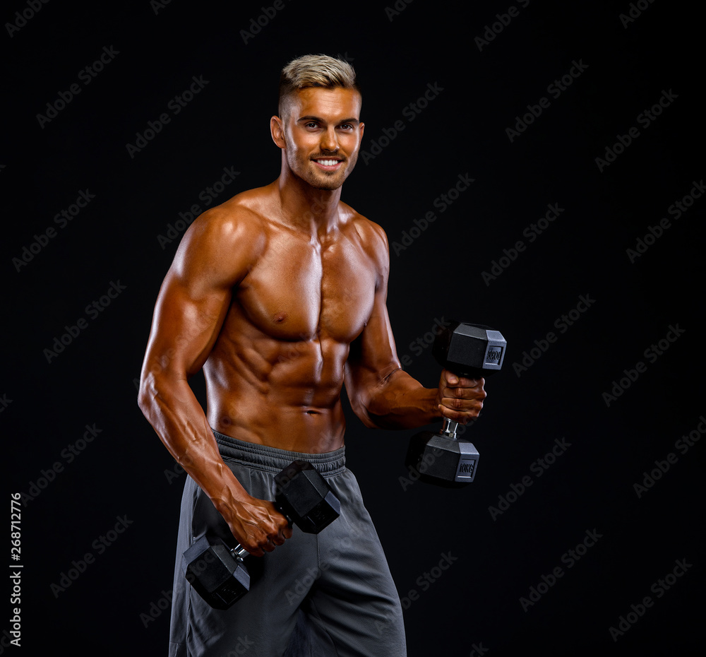 Muscular Men Lifting Weights. Performing Dumbbel Biceps Curls Muscular Men Lifting Weights. Performing Dumbbel Biceps Curls