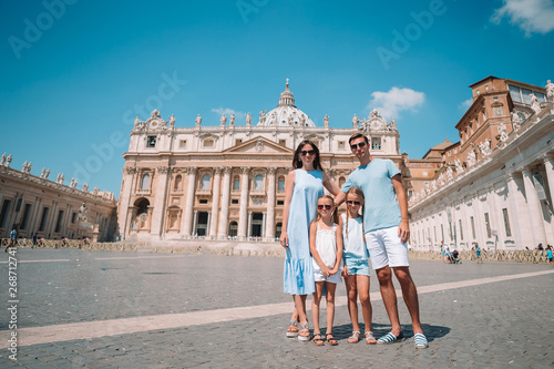 Happy family in Vatican city and St. Peter's Basilica church, Rome, Italy