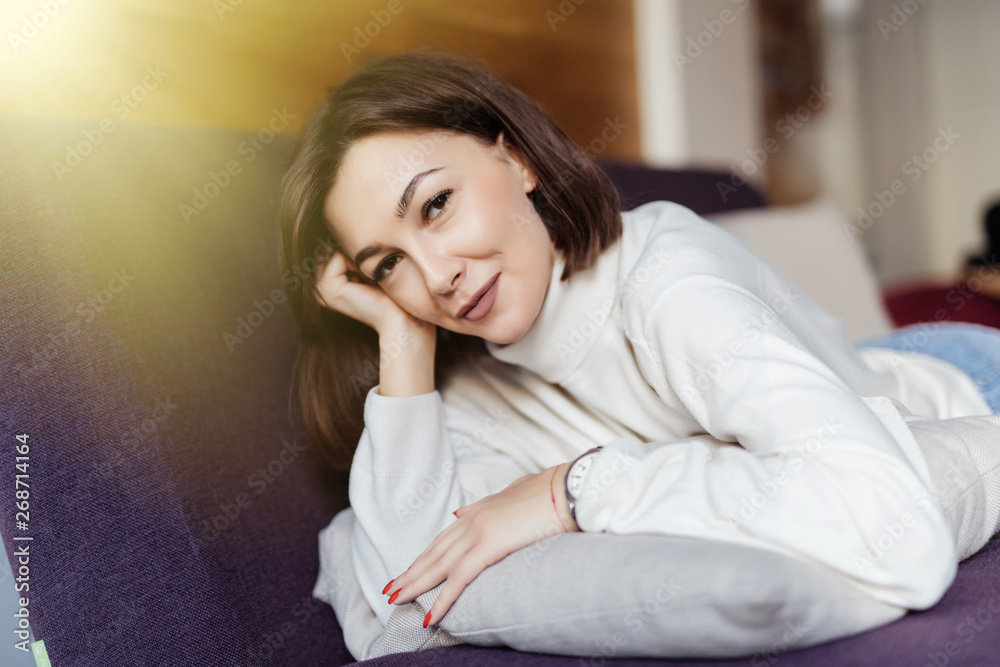 beautiful young woman lying relaxing on the couch, sofa home indoors beautiful young woman lying relaxing on the couch, sofa home indoors