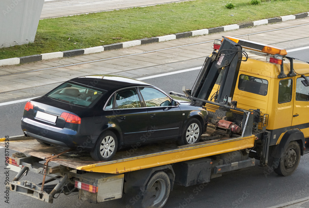 Tow truck with car rear view Tow truck with car rear view