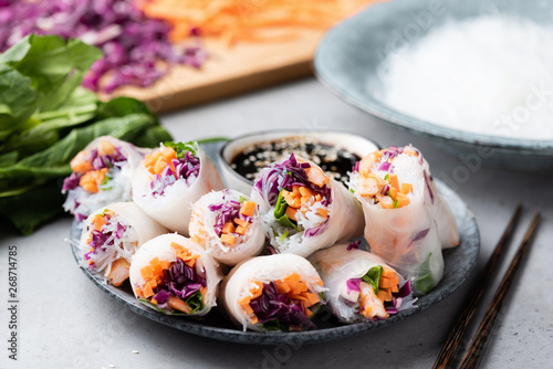 Vietnamese rice paper rolls with shrimp, red cabbage, carrot and rice noodles. Asian cuisine food. Spring rolls photo