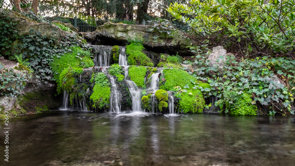 Numerous little waterfalls in Pierre Schneiter garden in Reims, France