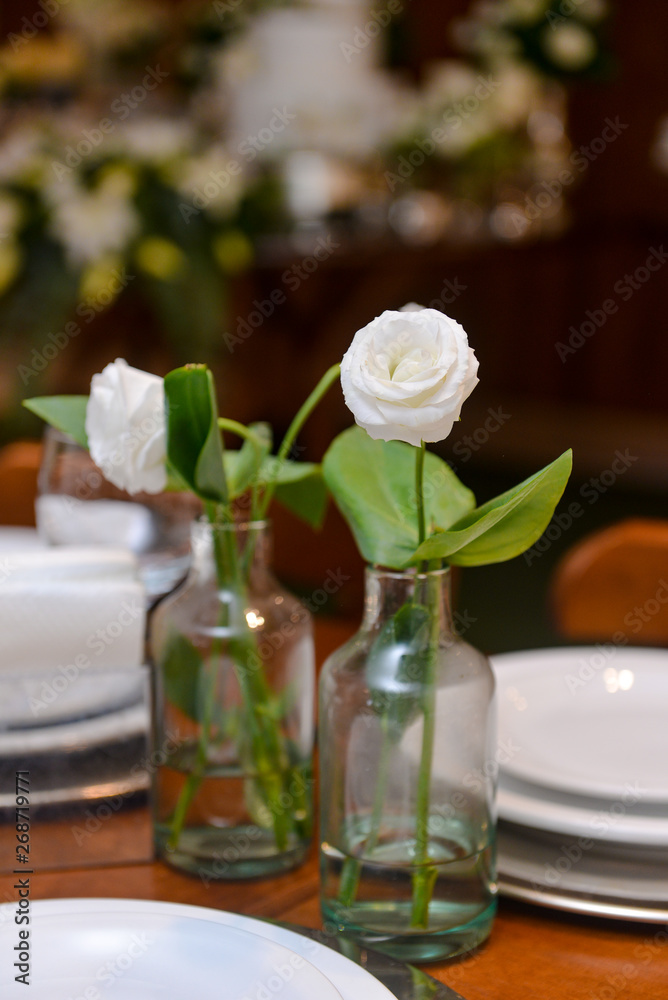 white roses in glass bottles, natural flowers