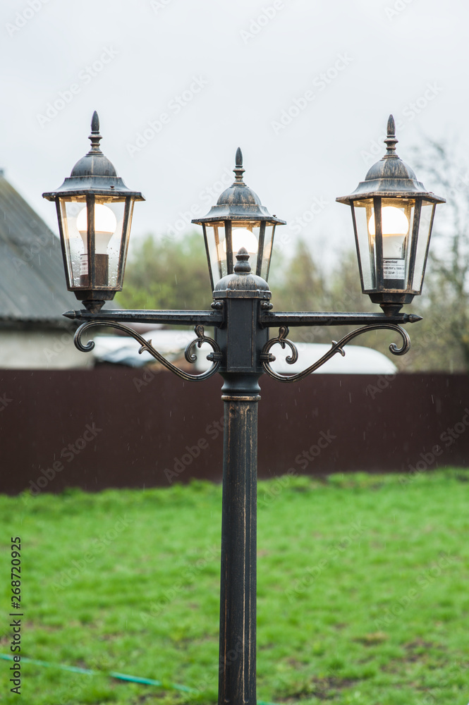 Vintage garden lantern with three lamps