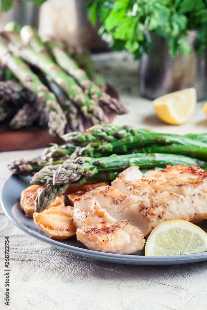 Fried cod fillet with green asparagus Fried cod fillet with green asparagus
