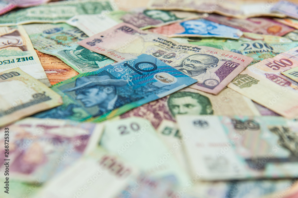 Australian dollar bill in front of other international banknotes Australian dollar bill in front of other international banknotes
