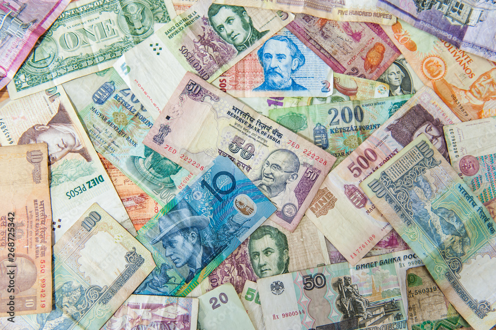 Colorful background made of used international money bills