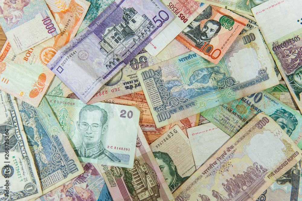 Many different international money bills / banknotes