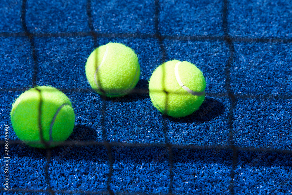 Tennis ball with racket on court