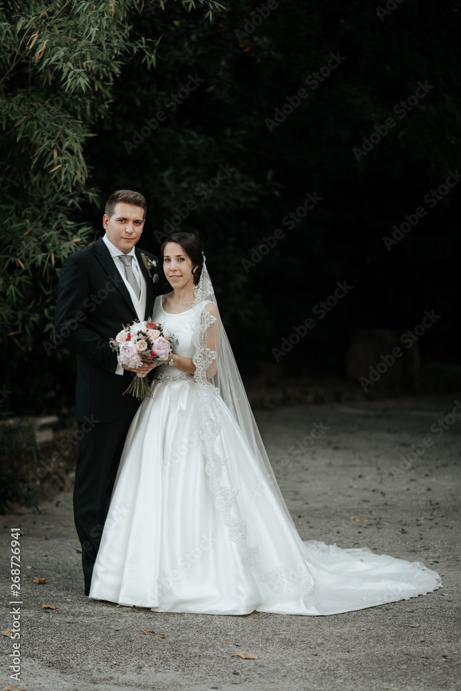 Happy classic bride and groom after wedding ceremony