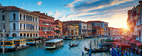 Panorama of Venice at sunset, Italy. Scenic view of Grand Canal in twilight. It is a top tourist attraction of Venice. Beautiful cityscape of Venice at dusk. Romantic water trip in Venice in evening.