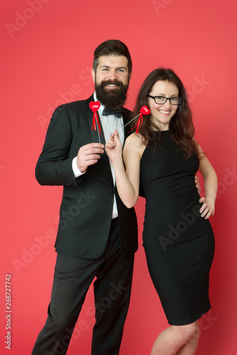 sexy couple in love. tuxedo man and sexy woman at formal party. formal couple. business meeting. valentines day heart. bearded businessman with sexy lady. love date and romance. feeling sexy photo