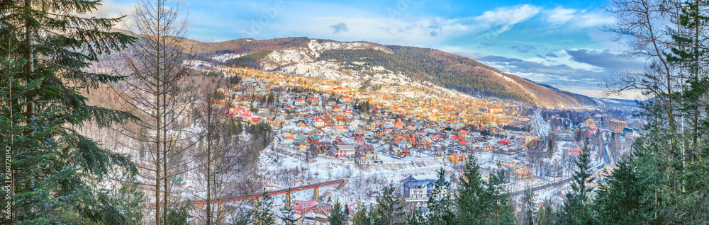 Obraz premium Winter landscape, panorama, banner - top view of the city Yaremche in the Carpathians Mountains valley, in Ukraine
