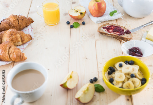 Breakfast on a wooden simple table.. Croissants Breakfast with aromatic tast. Good morning  great start to the day.