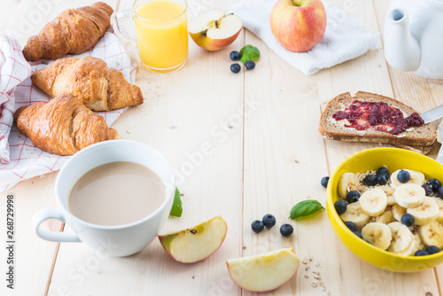 Breakfast on a wooden simple table.. Croissants Breakfast with aromatic tast. Good morning, great start to the day.