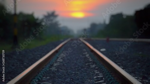 Blurred images in the atmosphere on a long train track And the sun is going to fall in the evening