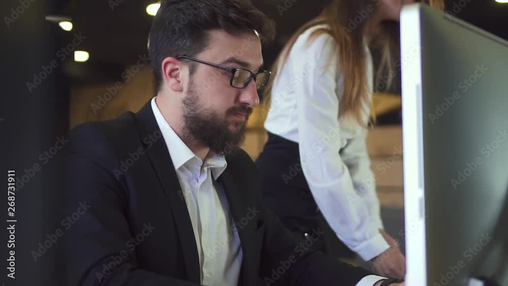 Businessman Working at the Computer in the Office with Coffee Businessman Working at the Computer in the Office with Coffee