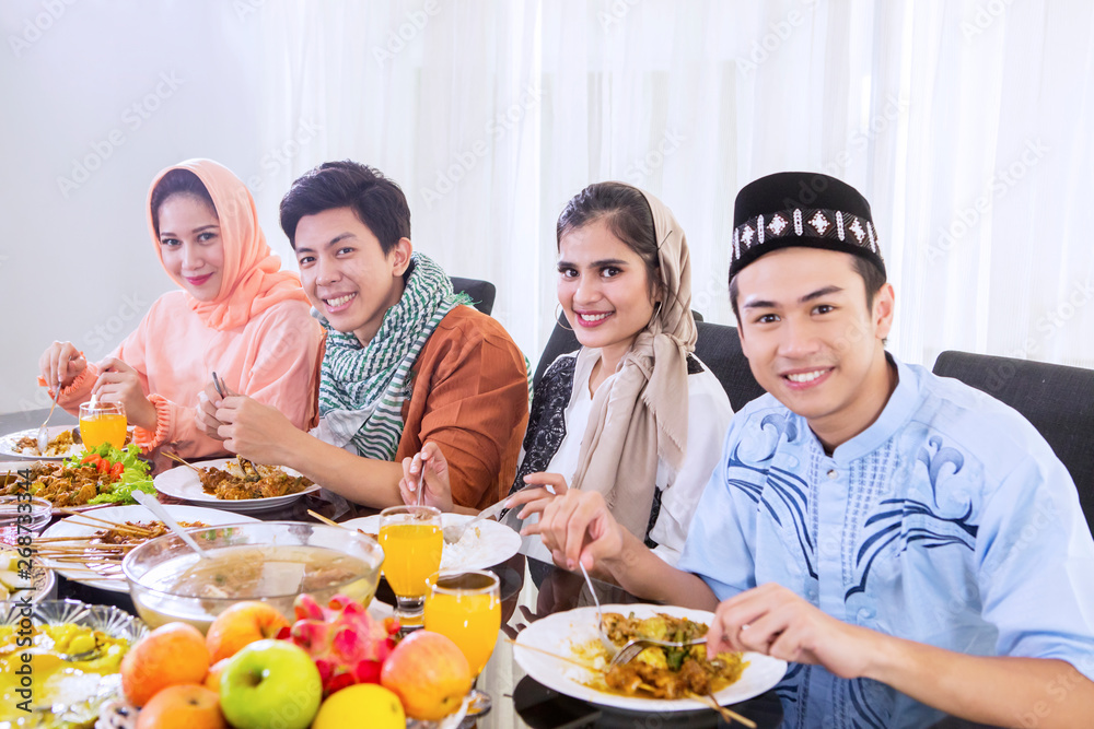 Muslim people enjoying meals at breaks the fast