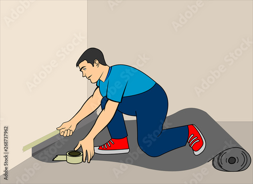 man applying carpet to the floor - Covering the floor with plastic