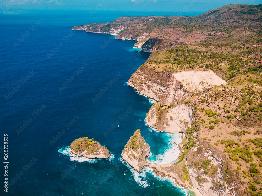Coastline and blue ocean in Nusa Penida. Aerial drone view of tropical island
