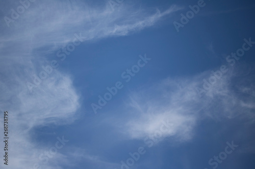 Fluffy Little Clouds. Blue skies and wispy clouds on a gorgeous summer day.