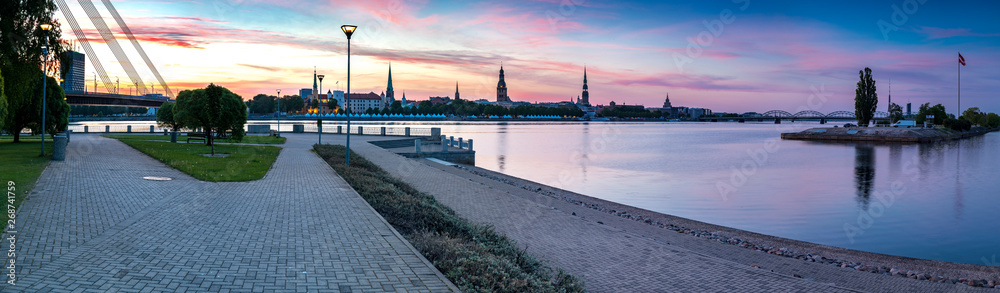 Panoramic view on historical district of old Riga city that is the capital of Latvia and famous Baltic city widely known among tourists due to its unique medieval and Gothic architecture Panoramic view on historical district of old Riga city that is the capital of Latvia and famous Baltic city widely known among tourists due to its unique medieval and Gothic architecture