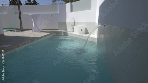 swimming pool with water fature in Spain photo