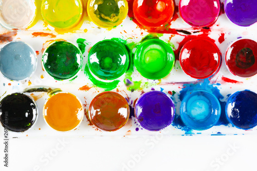 Obraz na płótnie A set of children's paints in circular forms close-up. Copy space for text w salonie