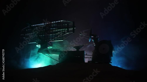 Silhouettes of satellite dishes or radio antennas against night sky. Space observatory or Air defence radar over dramatic night sky. Creative artwork decoration. Selective focus