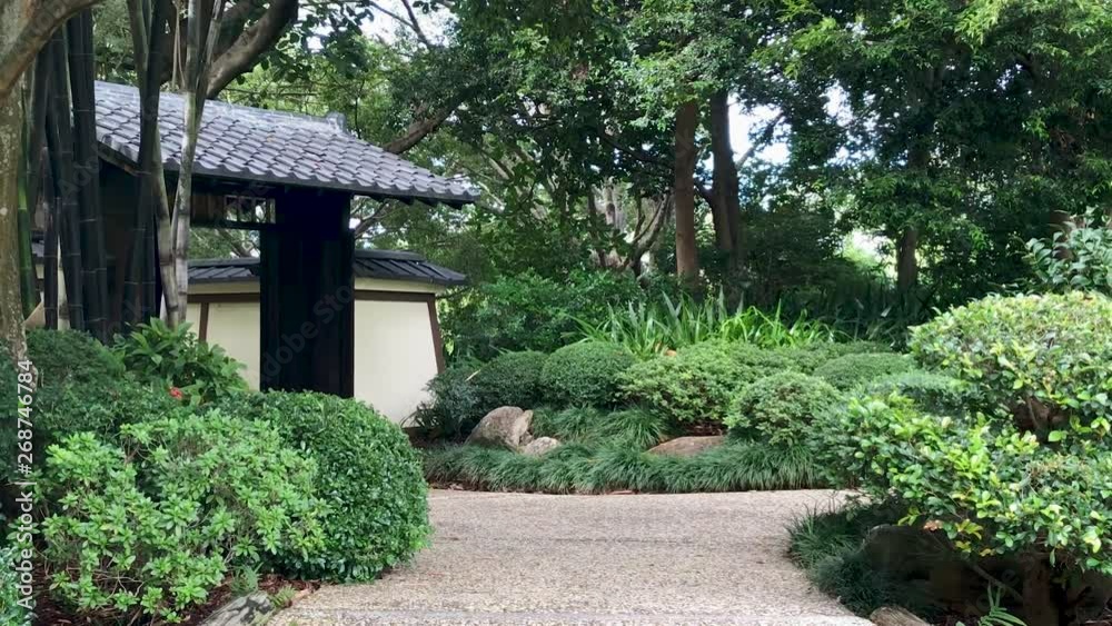 Japanese hut sits in tranquil garden Japanese hut sits in tranquil garden